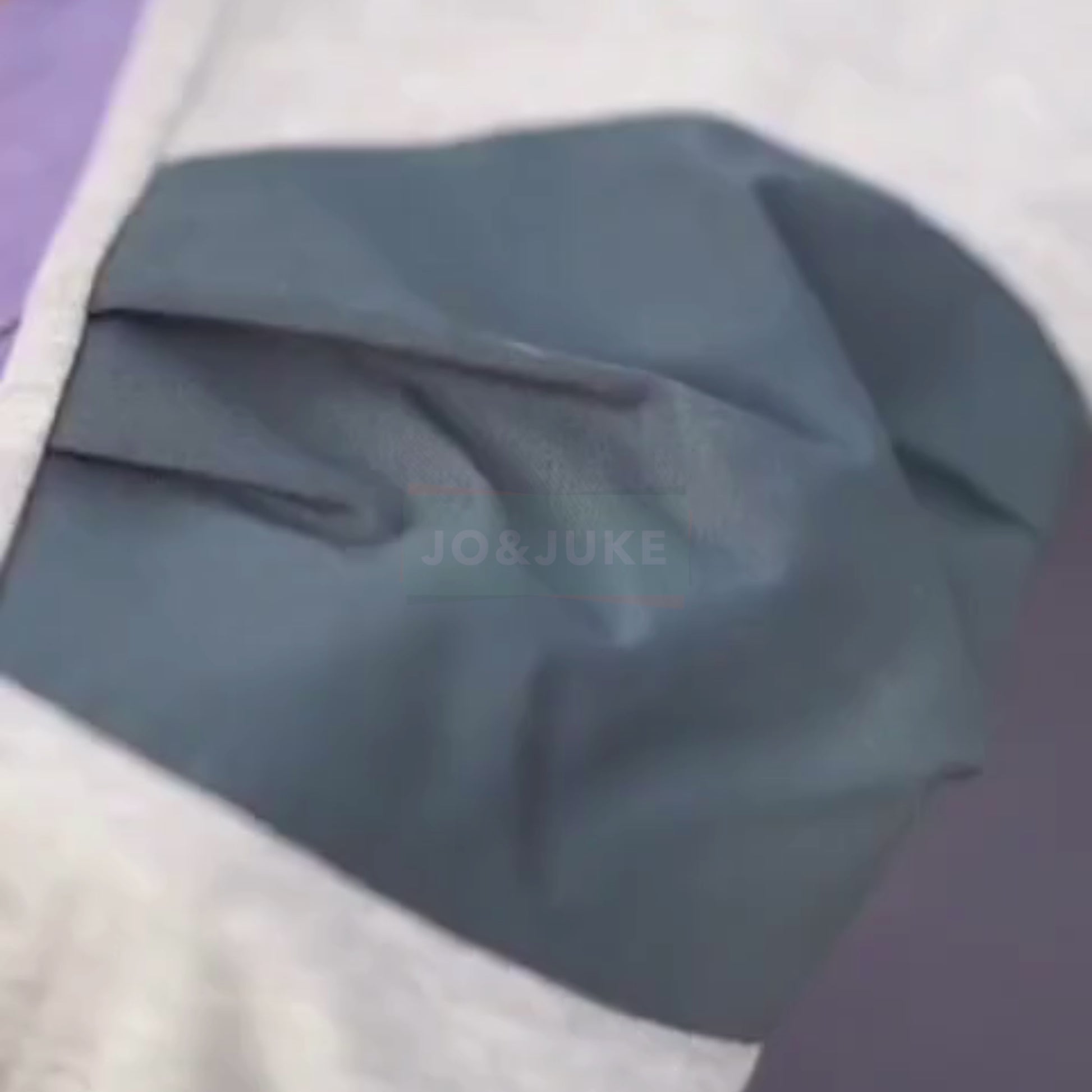 Close-up of a fabric detail showcasing the color and texture of the Dizlikli Pantolon.