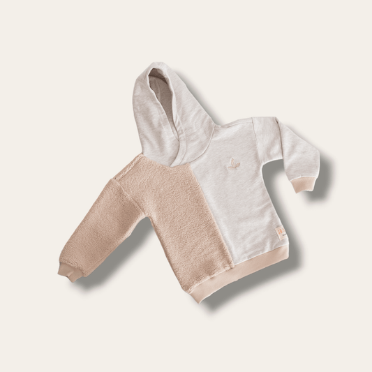 Organik pamuk teddy sweatshirt, yumuşak ve şık tasarımıyla sıcak tutar.